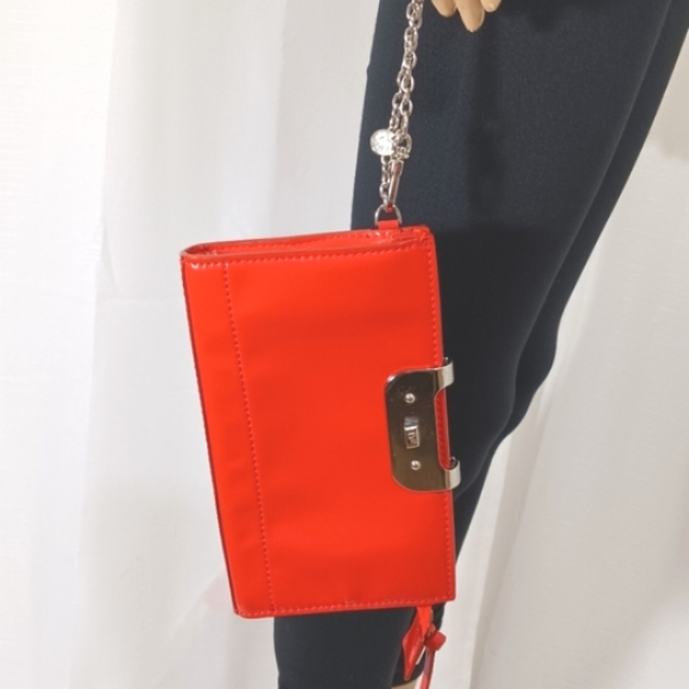 DIANE VON FURSTENBERG Deep Orange Patent Leather Magnetic Clasp Wristlet…